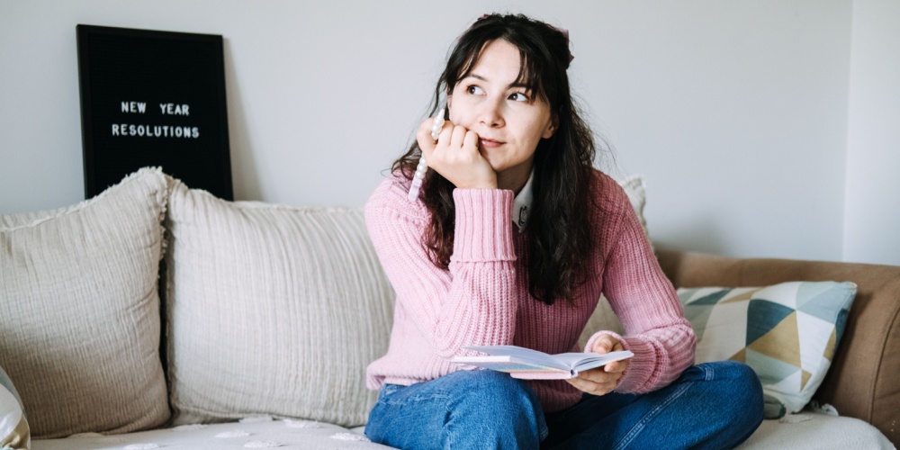 Woman thinking on couch